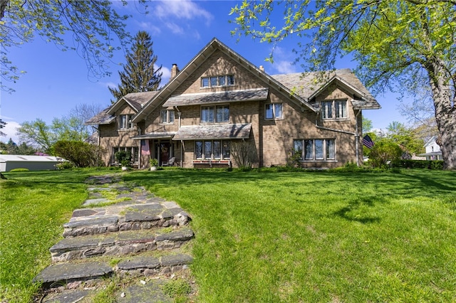 43 S Main St, Elba, NY 14058 - rear view of house featuring a chimney, a lawn, and brick siding