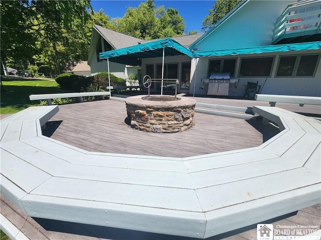 3539 Morley Rd, North Harmony, NY 14710 - wooden deck with a fire pit