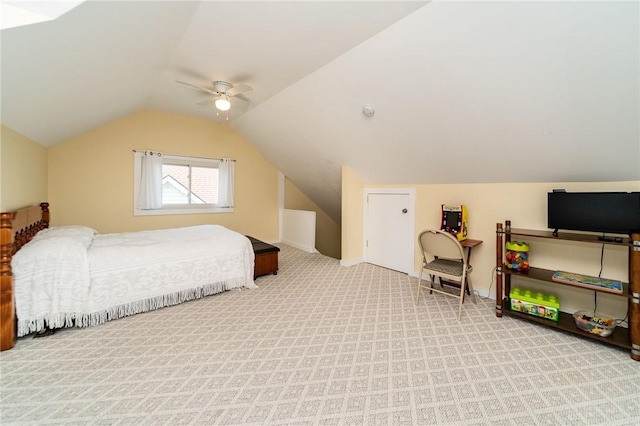 bedroom with carpet flooring, a ceiling fan, and lofted ceiling