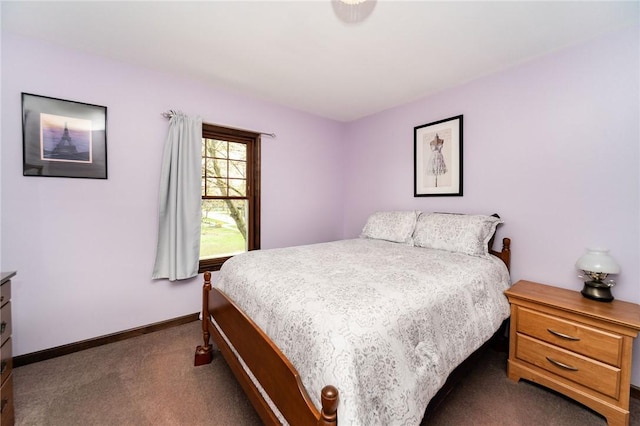 bedroom with baseboards and carpet flooring