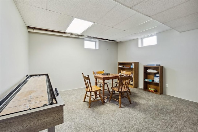 dining room with plenty of natural light, carpet flooring, and a paneled ceiling