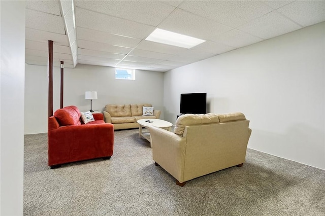 living room with carpet and a paneled ceiling