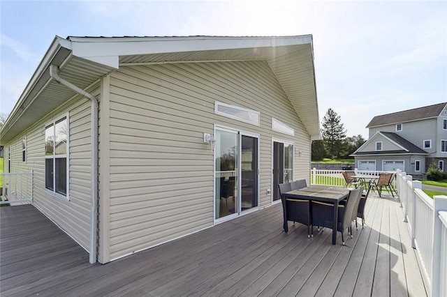 wooden terrace with outdoor dining area