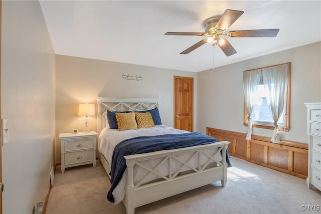 bedroom with ceiling fan and light carpet