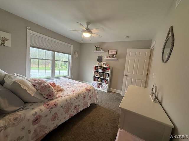 bedroom with dark colored carpet, baseboards, and a ceiling fan