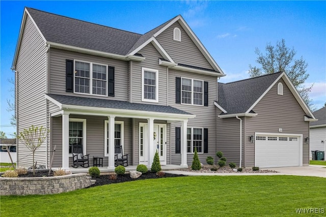 view of front of home featuring a garage, roof with shingles, a front yard, a porch, and driveway