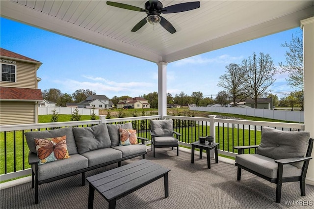 view of patio / terrace featuring an outdoor hangout area, a residential view, a ceiling fan, and fence