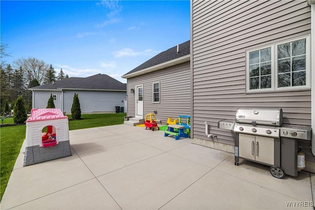 view of patio / terrace featuring a grill and entry steps