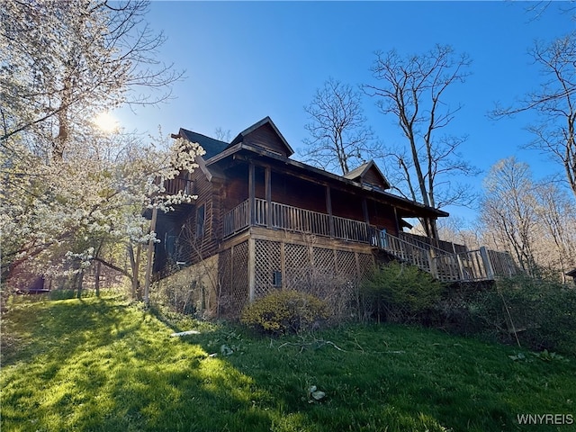 rear view of property with a porch and a yard