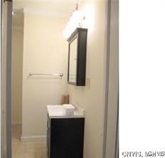 bathroom featuring baseboards and vanity