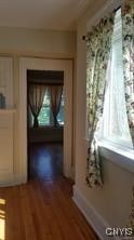 corridor featuring wood finished floors