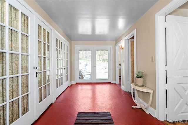 unfurnished sunroom with french doors