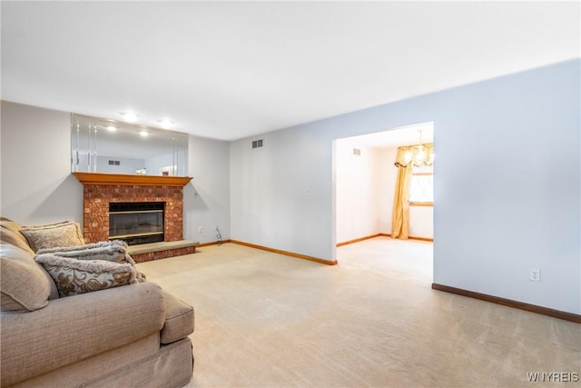 carpeted living area featuring baseboards, a chandelier, a fireplace, and visible vents