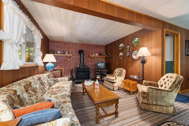 living room with carpet floors, wooden walls, wooden ceiling, and a wood stove