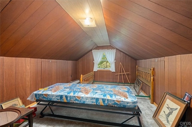 bedroom featuring carpet floors, wood ceiling, wood walls, and lofted ceiling