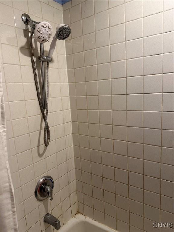 full bathroom featuring shower / tub combo with curtain