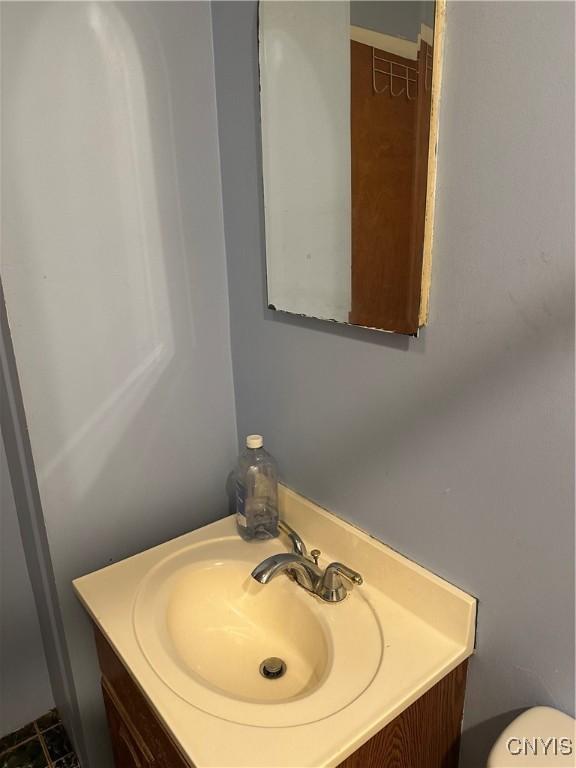 bathroom with vanity and toilet