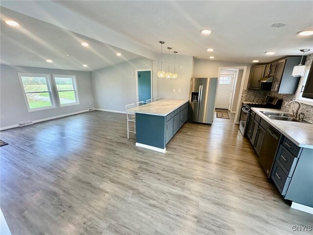 4850 Palmer Rd, Lee, NY 13471 - kitchen featuring a sink, a kitchen breakfast bar, stainless steel appliances, open floor plan, and a peninsula