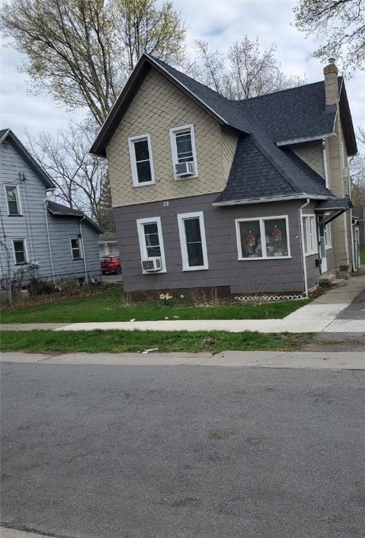 28 Upton Pl, Rochester, NY 14612 - traditional-style house with a chimney, roof with shingles, and cooling unit