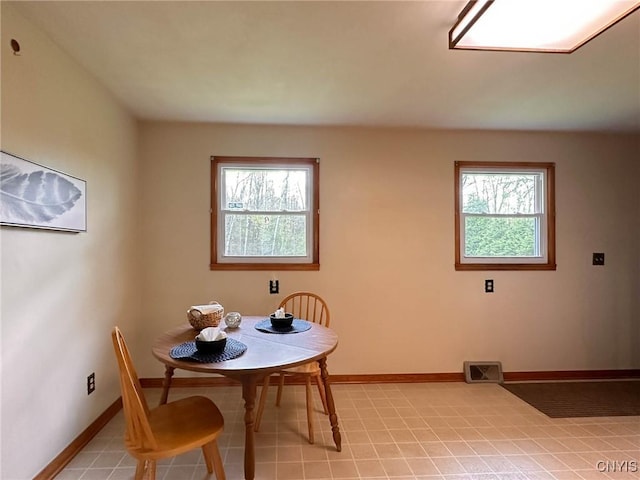 28 Concord Blvd, New Hartford, NY 13413 - dining room featuring baseboards, visible vents, and a healthy amount of sunlight