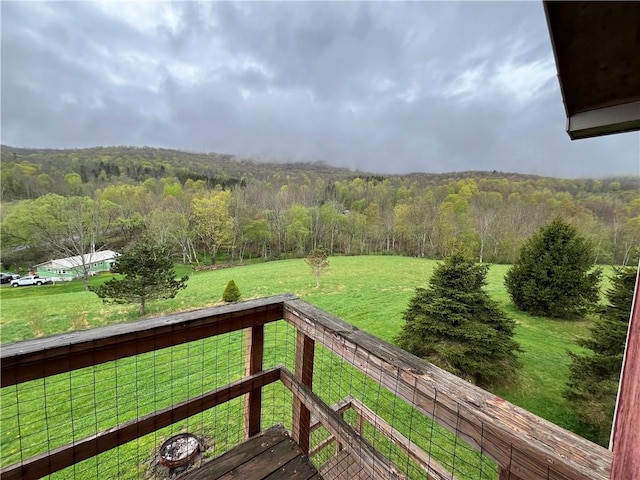 view of yard with a forest view
