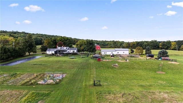 birds eye view of property with a rural view