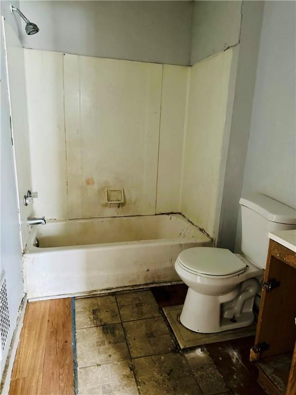 full bath with vanity, shower / bathtub combination, and toilet