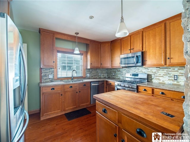 53 W 5th St, Dunkirk-City, NY 14048 - kitchen with brown cabinets, appliances with stainless steel finishes, a sink, wood counters, and dark wood-type flooring