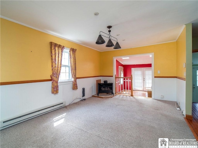 53 W 5th St, Dunkirk-City, NY 14048 - unfurnished living room featuring french doors, crown molding, a wood stove, a baseboard radiator, and carpet