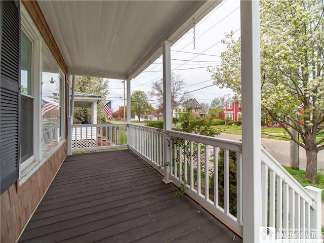 53 W 5th St, Dunkirk-City, NY 14048 - wooden terrace featuring a residential view and covered porch