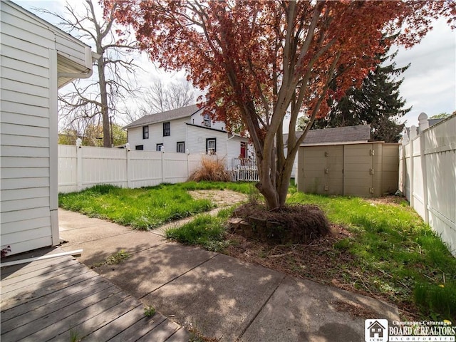 53 W 5th St, Dunkirk-City, NY 14048 - view of yard with an outbuilding, a fenced backyard, and a shed