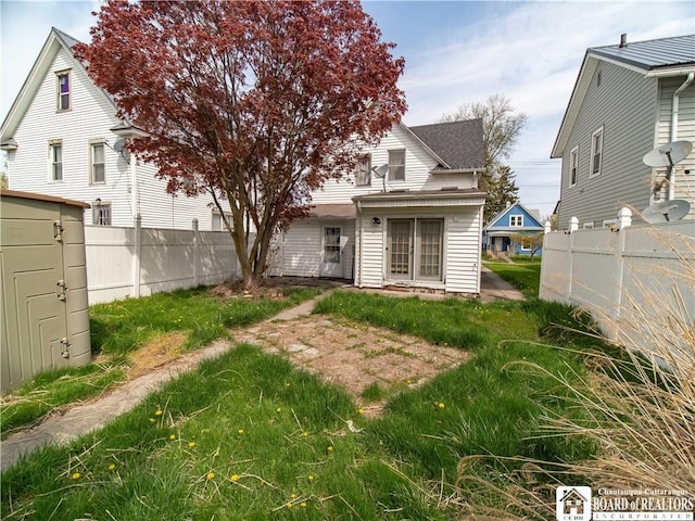 53 W 5th St, Dunkirk-City, NY 14048 - rear view of house featuring fence
