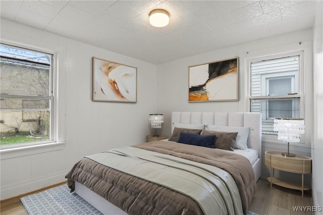 bedroom featuring wood finished floors