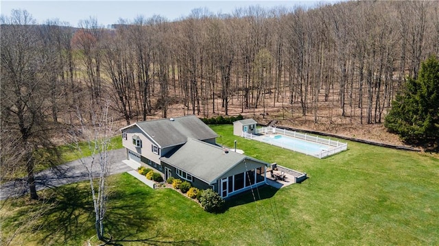 drone / aerial view featuring a forest view