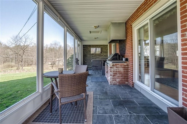 sunroom with exterior kitchen