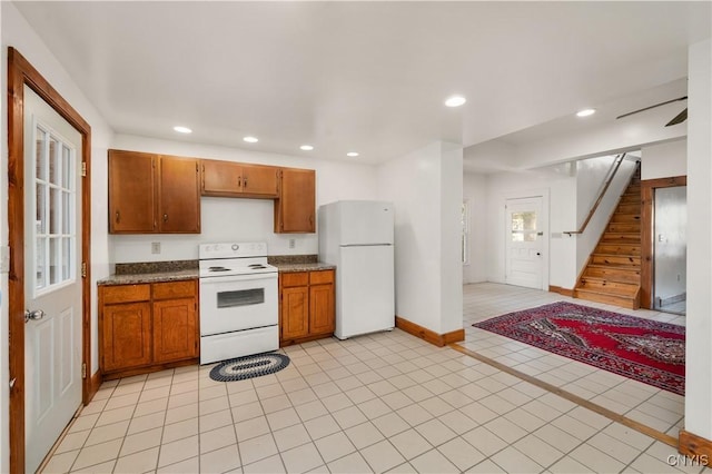 14 Meadow St, Kirkland, NY 13323 - kitchen with recessed lighting, baseboards, brown cabinetry, and white appliances