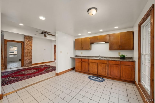 14 Meadow St, Kirkland, NY 13323 - kitchen featuring a sink, brown cabinets, baseboards, and recessed lighting