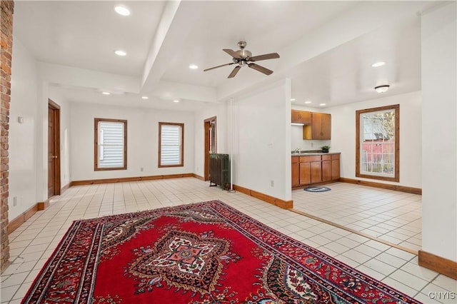 14 Meadow St, Kirkland, NY 13323 - unfurnished living room featuring light tile patterned flooring, ceiling fan, and baseboards