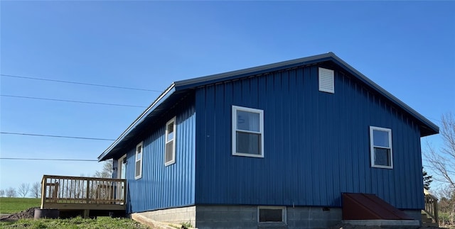 view of side of home featuring a deck
