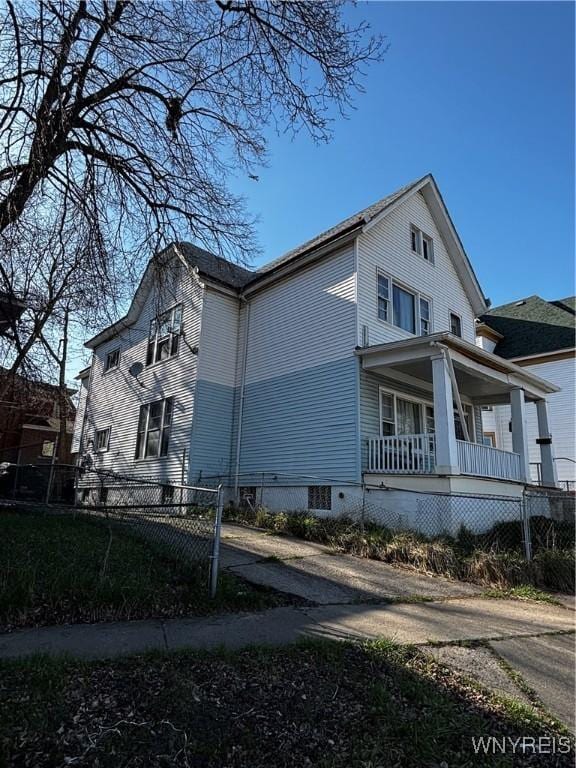 66 W Parade Ave, Buffalo, NY 14208 - view of side of home featuring fence and covered porch