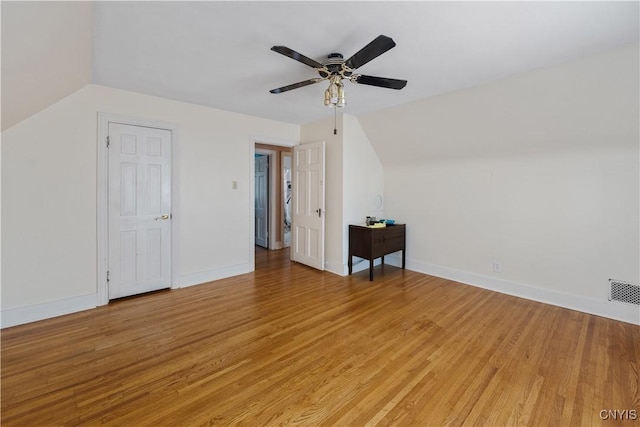 bonus room featuring a ceiling fan, visible vents, lofted ceiling, and light wood-type flooring
