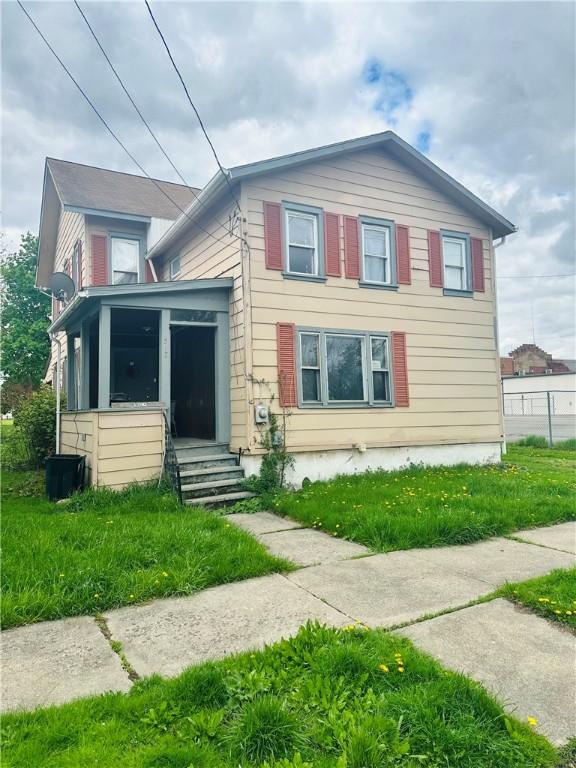 517 High St, Elmira-City, NY 14901 - view of front of home with entry steps and a sunroom