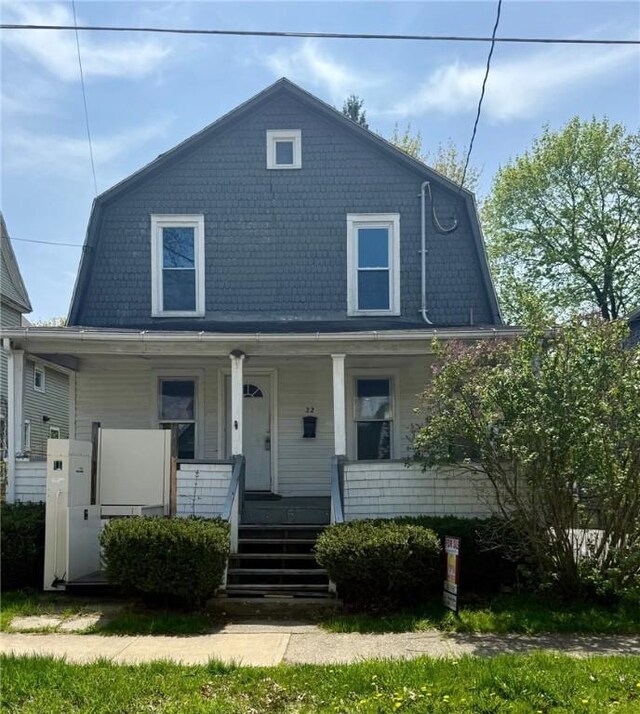 22 W Hazel St, Corning-City, NY 14830 - dutch colonial featuring a porch and a gambrel roof
