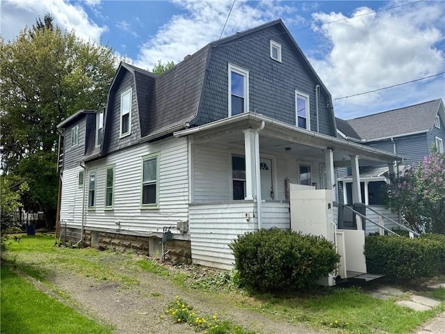22 W Hazel St, Corning-City, NY 14830 - dutch colonial with roof with shingles, covered porch, and a gambrel roof