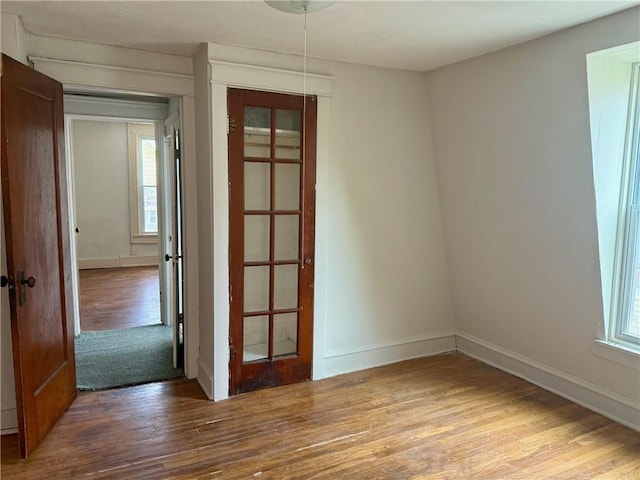 22 W Hazel St, Corning-City, NY 14830 - unfurnished room featuring baseboards and wood finished floors
