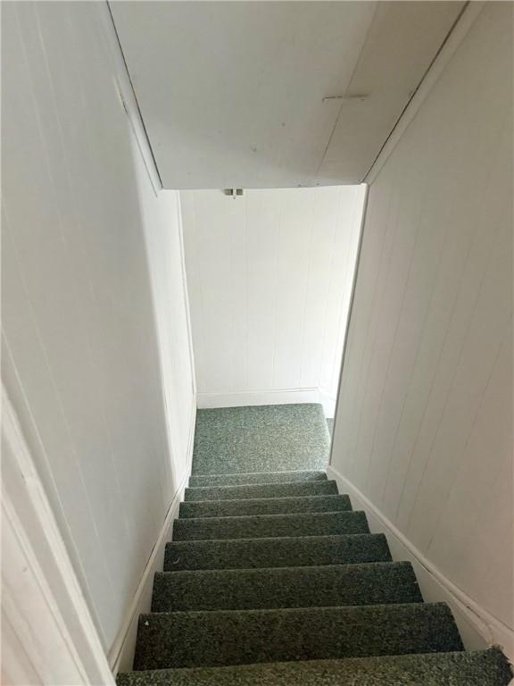 22 W Hazel St, Corning-City, NY 14830 - stairs featuring carpet floors and baseboards