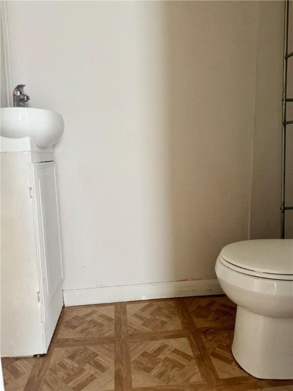 22 W Hazel St, Corning-City, NY 14830 - half bath featuring baseboards, toilet, and vanity