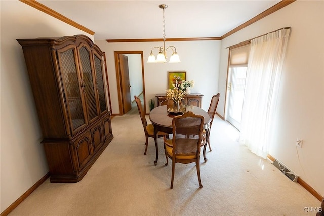 dining area with a notable chandelier, light carpet, baseboards, visible vents, and ornamental molding