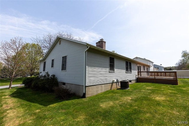 view of property exterior featuring a lawn, a chimney, cooling unit, and a deck