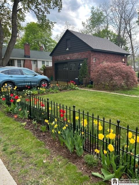 4 Brewer Pl, Westfield, NY 14787 - view of yard with a garage and fence